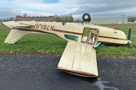 N761JU inverted at the edge of Runway 24