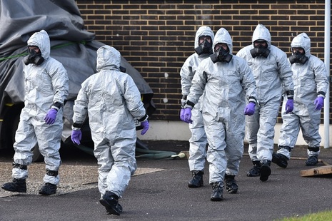 Salisbury, UK - March 8, 2018: Army and police in hazmat suits take part in an investigation and clean-up operation after the nerve agent poisoning of former Russian spy Sergei Skripa