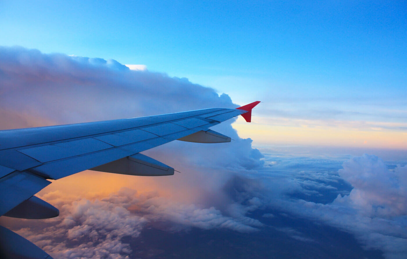 Plane wing in the sky