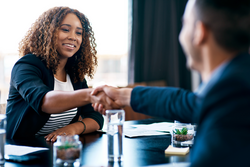 Welcome to the company. Cropped shot of two business colleagues shaking hands during a meeting in the boardroom.; Shutterstock ID 2145920187; purchase_order: Bynder library; job: ; client: ; other: