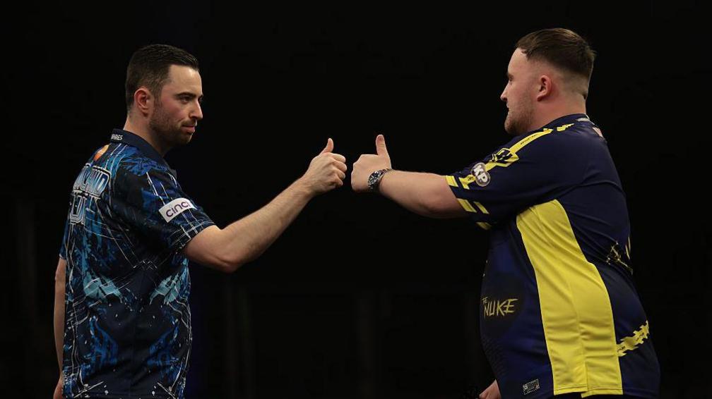 Luke Humphries fist-bumps Luke Littler