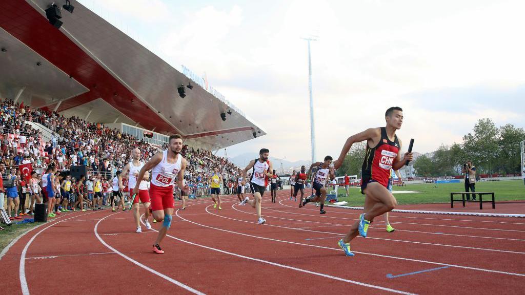 Athletes compete in a relay at the 2017 Deaflympics in Turkey