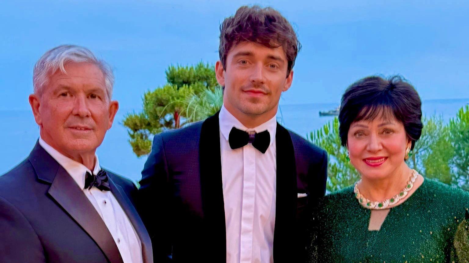 Greg Bensel with Charles Leclerc and New Orleans Saints owner Gayle Benson in Monaco in July 2025