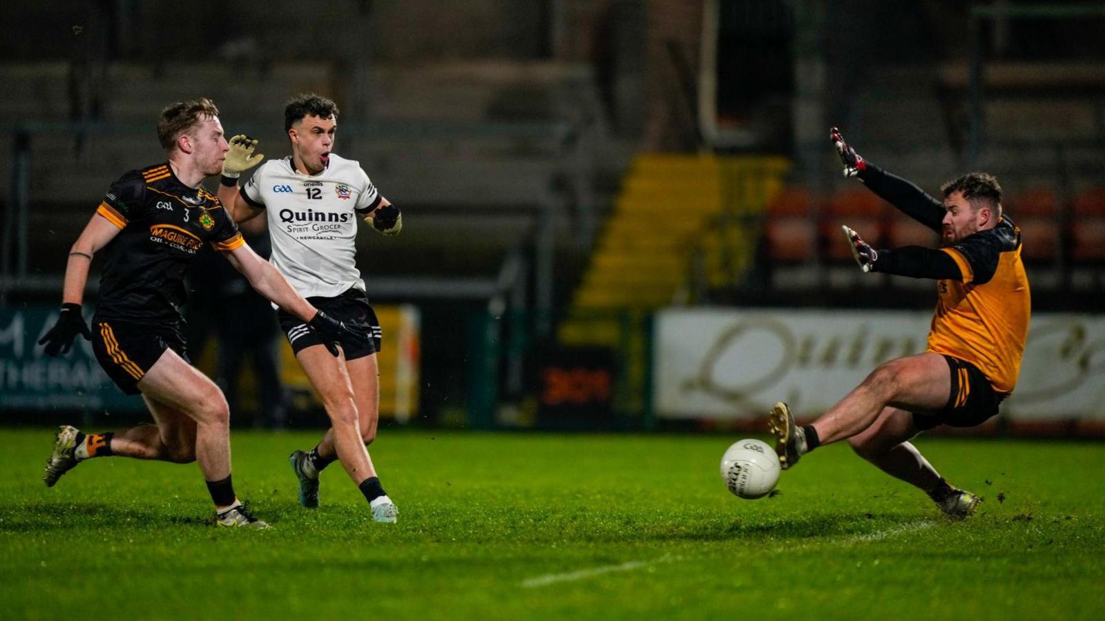 Shealan Johnston scores a goal against Erne Gaels