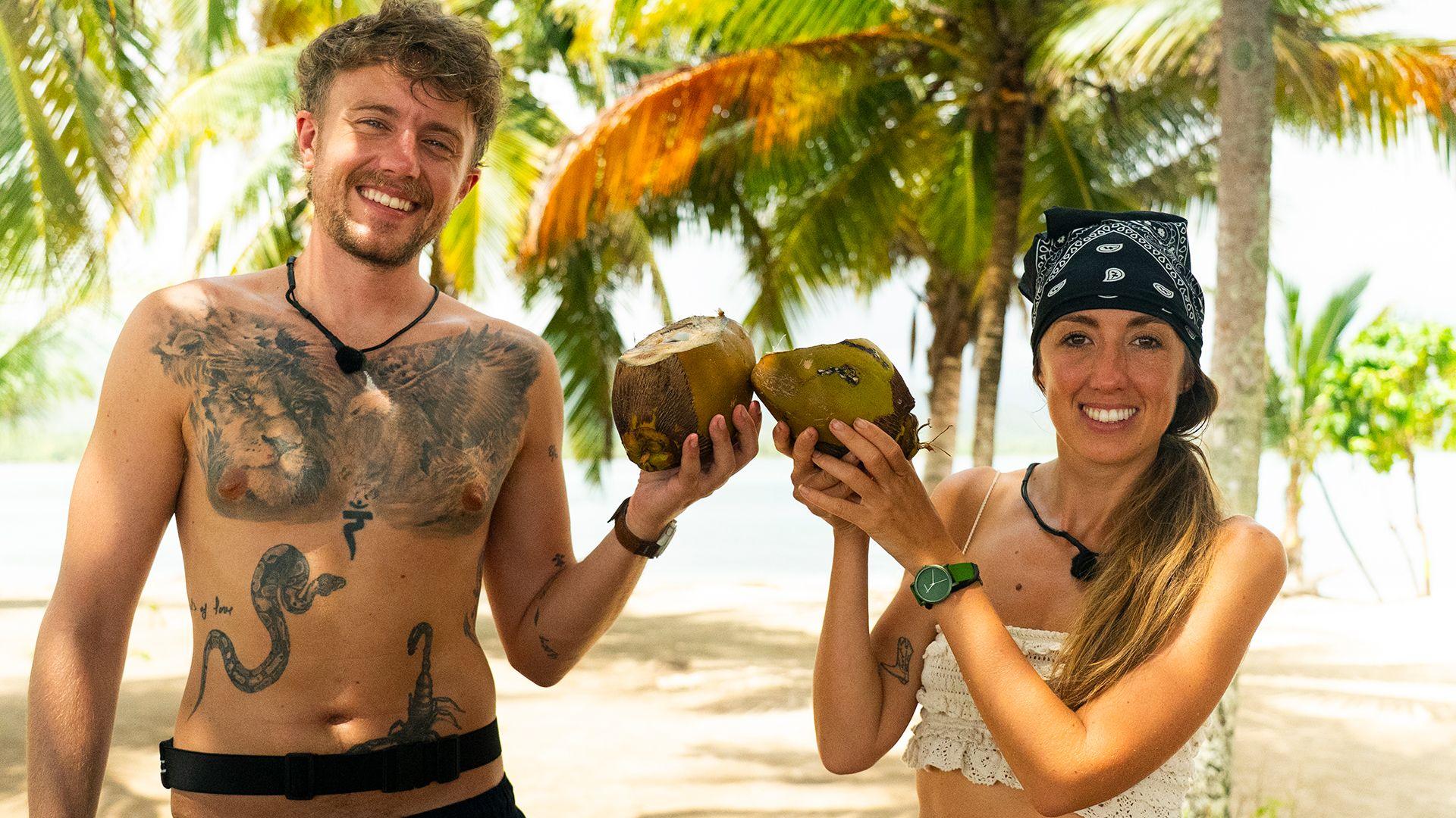 Roman Kemp and his sister Harleymoon smiling on a tropical beach holding up coconuts