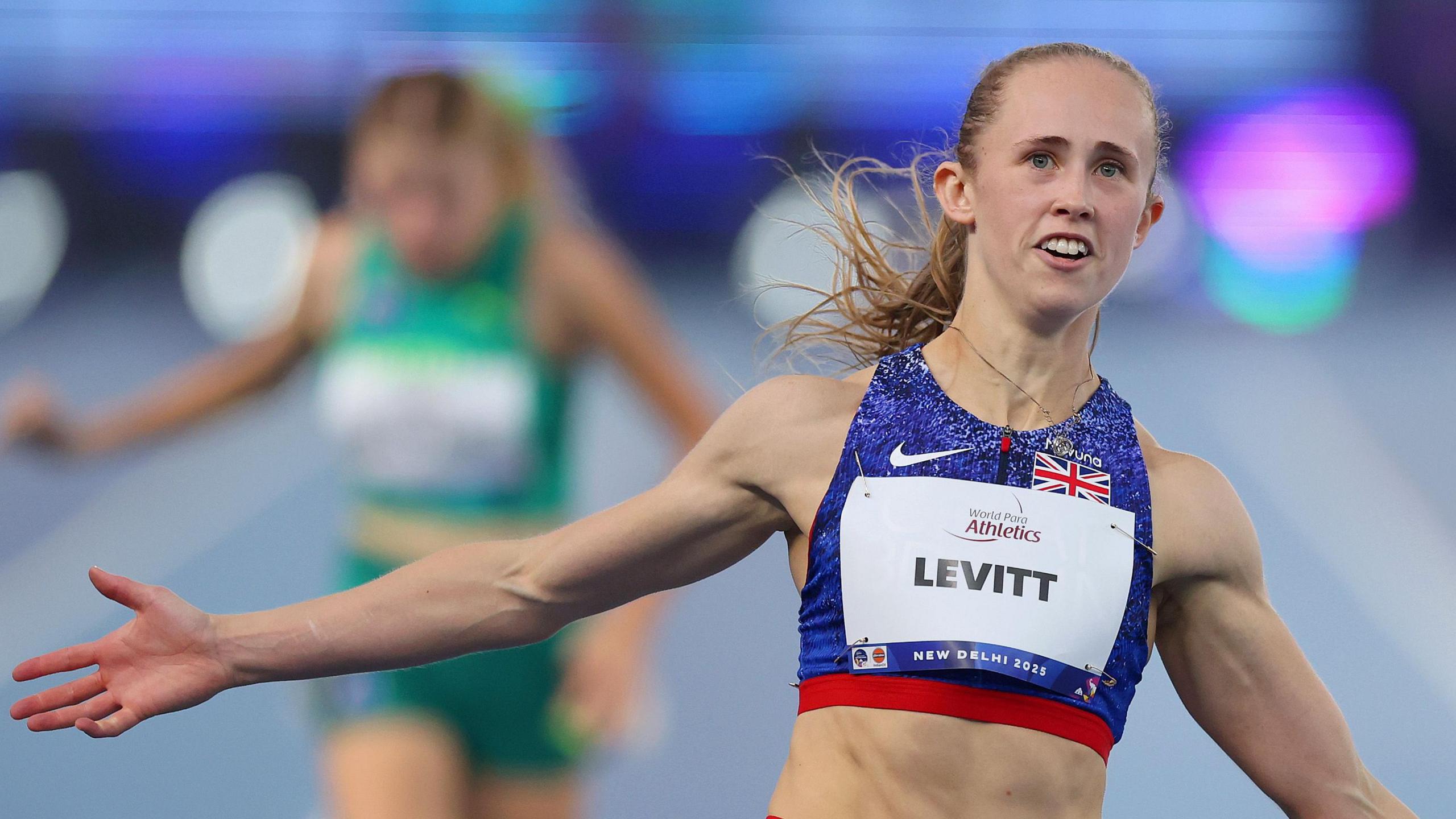 Victoria Levitt of Team GB celebrates winning the gold medal during the Women's 100m T44 at the World Para-athletics Championships in New Delhi