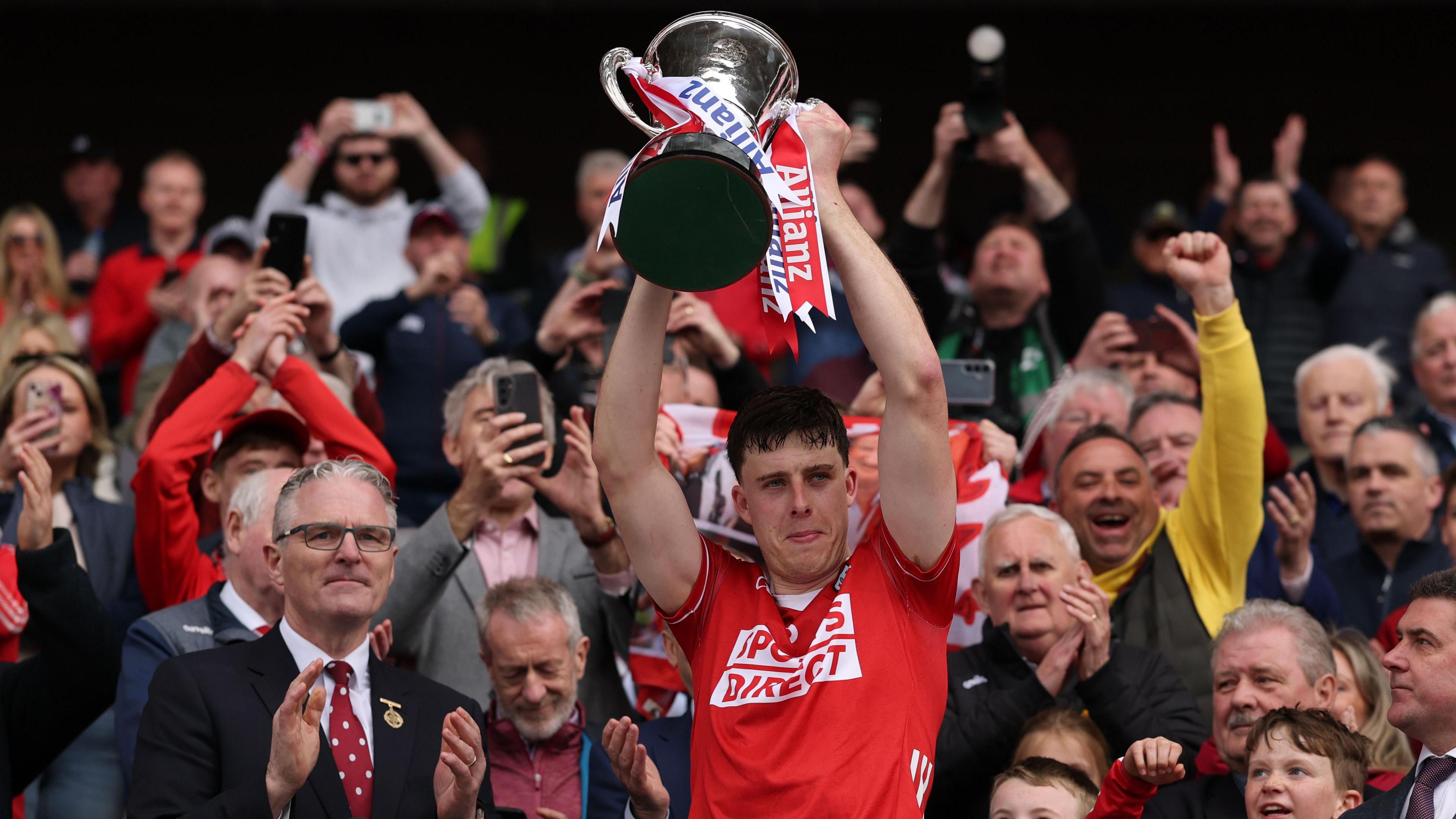 Cork captain Robert Downey lifts the Hurling League trophy for 2025
