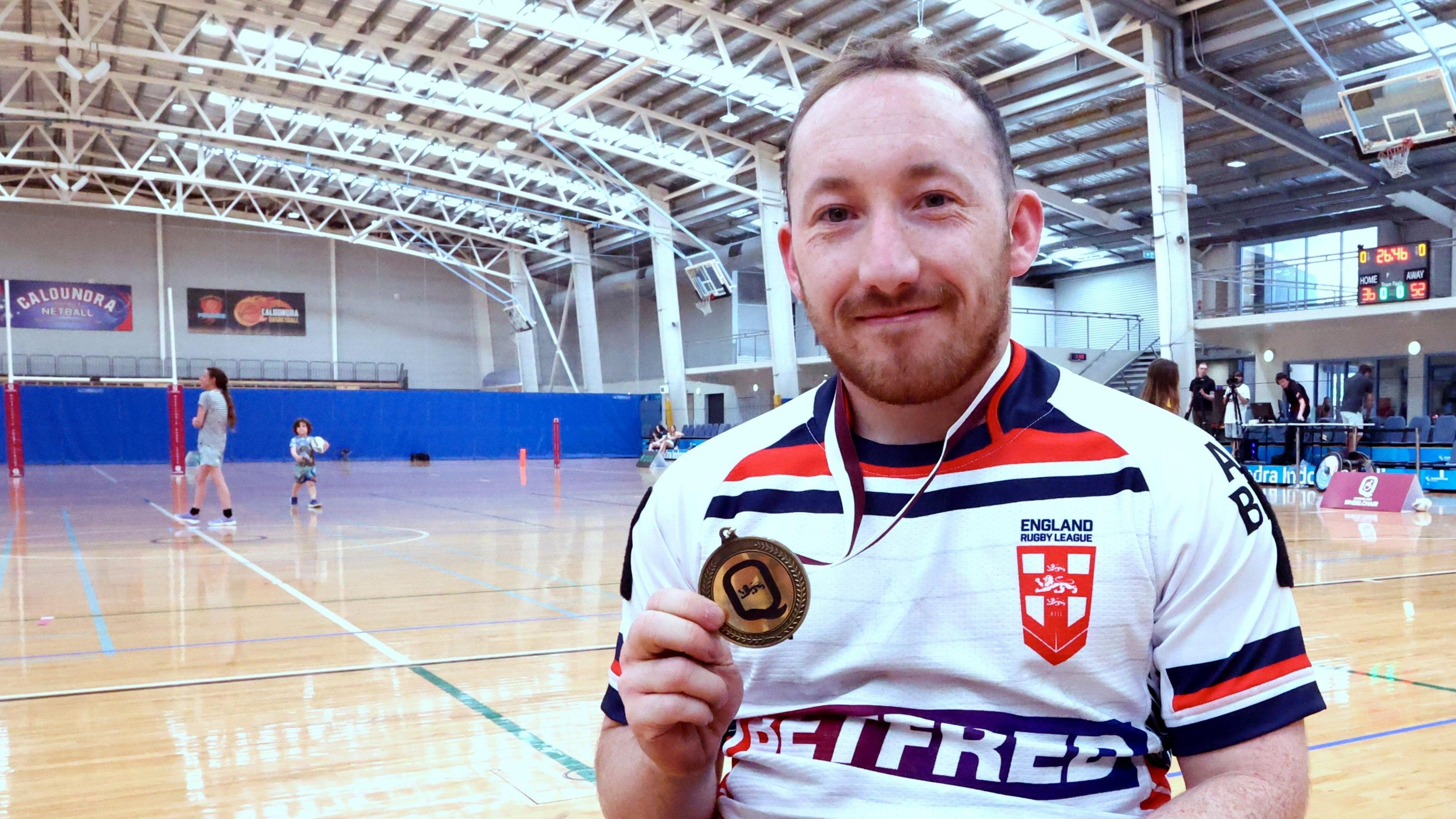 Nathan Collins shows off his man of the match medal