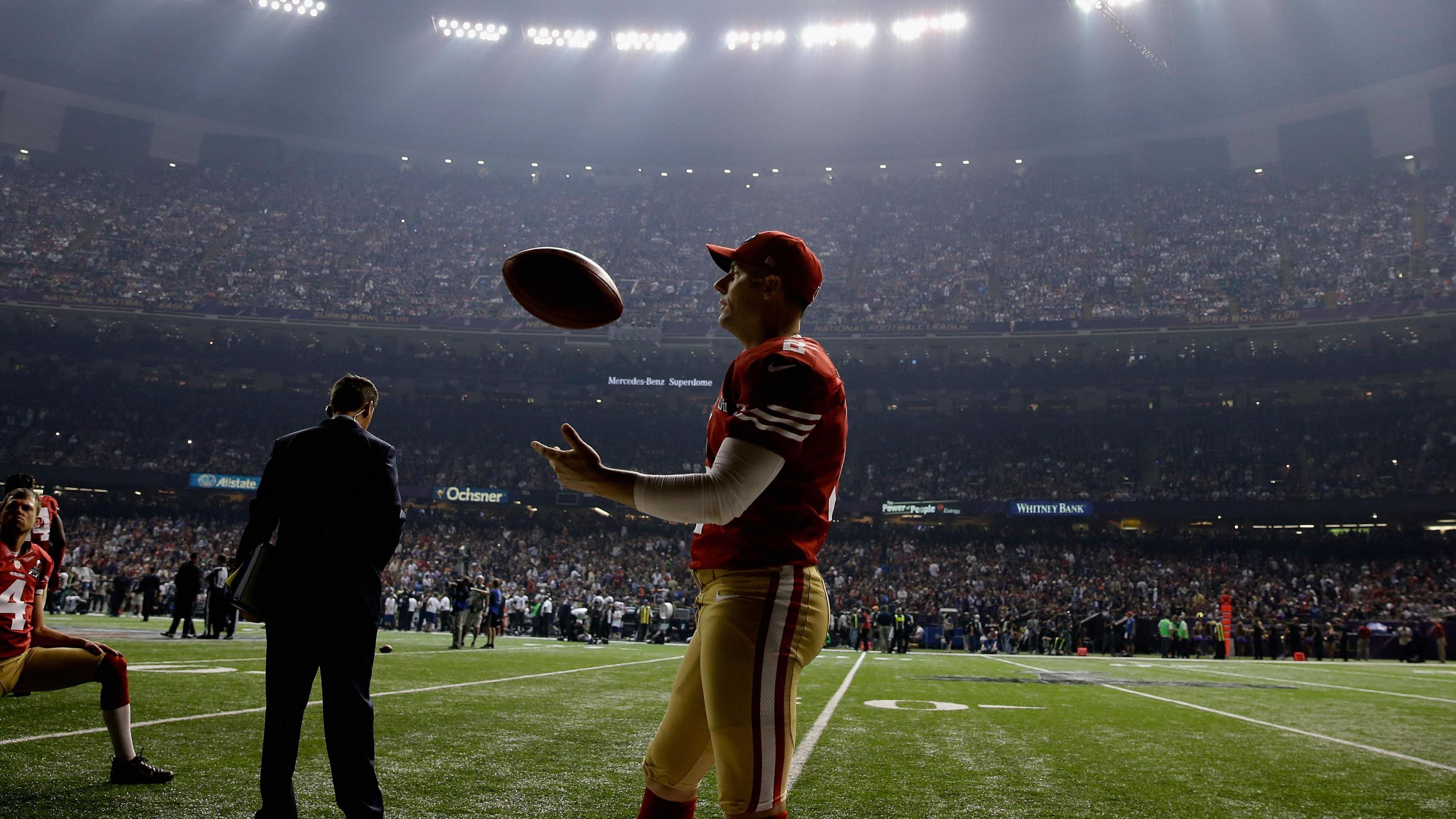 NFL players on the field during the Super Bowl blackout in New Orleans Superdome in 2013