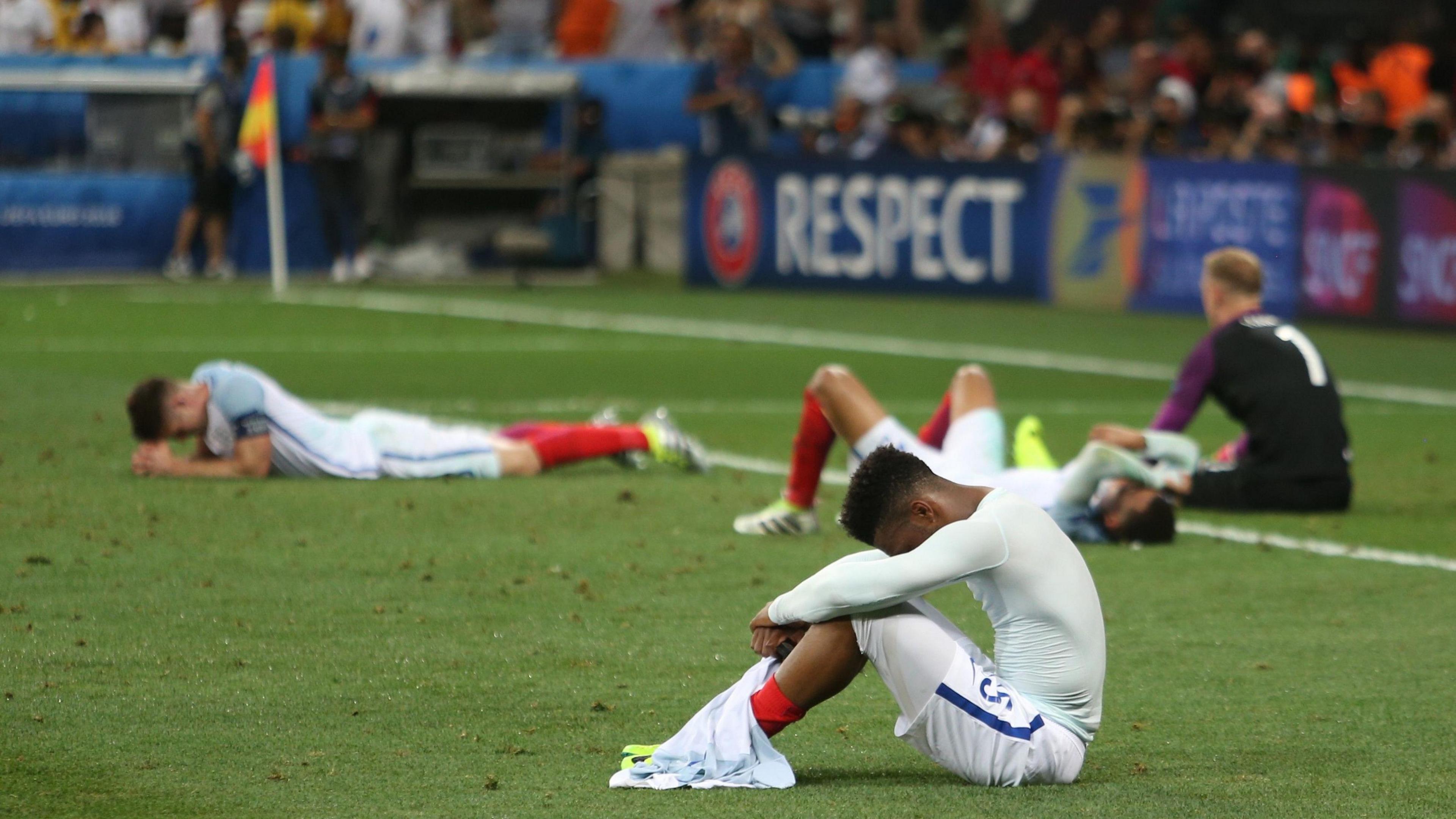 England players are dejected after losing to Iceland