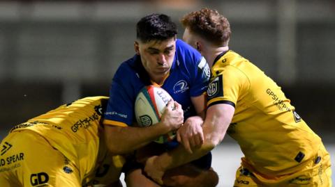 Leinster full-back Jimmy O'Brien carries the ball into the Dragons' defence at Rodney Parade