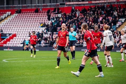 Lisa Naalsund celebrates after scoring hers and Manchester United's second goal of the day against Liverpool