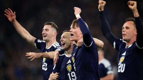 Scott McTominay leads Scotland's celebrations after qualifying for the World Cup