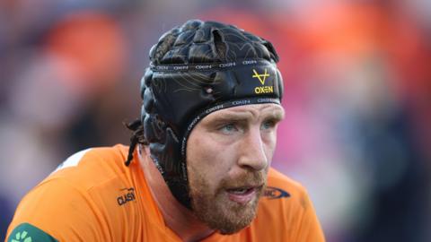 Jackson Hastings, wearing a scrum cap, playing for Newcastle Knights in the NRL in 2025