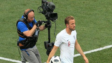 Harry Kane is filmed by a cameraman at the 2018 World Cup