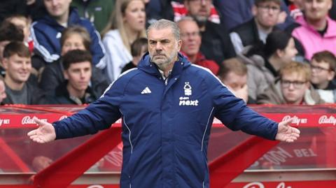 Ange Postecoglou holds his arms outstretched