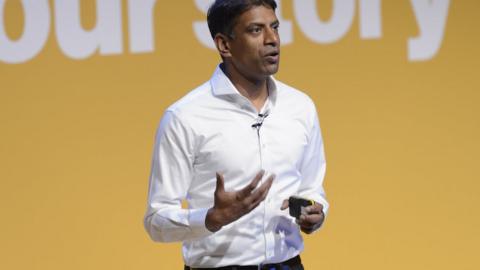 Vasant Narasimhan giving a speech