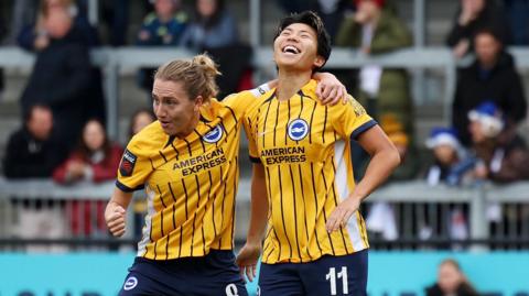 Kiko Seike and Maisie Symonds of Brighton celebrate as Seike scores against London City Lionesses