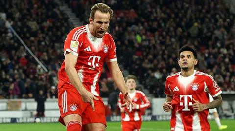 Harry Kane celebrates after scoring for Bayern Munich
