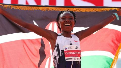 Ruth Chepngetich celebrates after setting a world record at the Chicago Marathon in 2024
