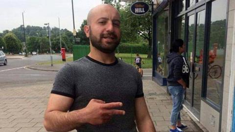 Mesut Olgun outside a takeaway in Bristol