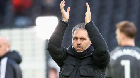 Leicester boss Marti Cifuentes applauds the travelling fans after the 3-1 win at Derby