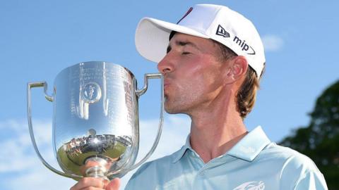 David Puig kissing the Australian PGA Championship trophy