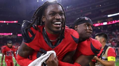 Houston Texans cornerback Kamari Lassiter and safety Calen Bullock celebrate after beating the Buffalo Bills