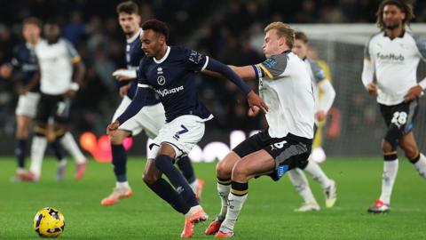 Thierno Ballo has the ball under pressure from Sondre Langas