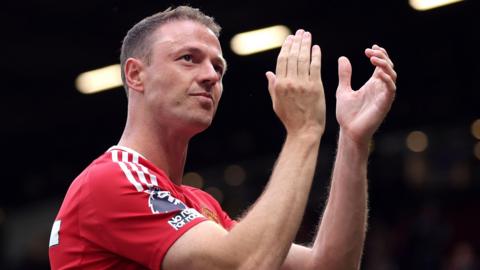 Jonny Evans applauding fans