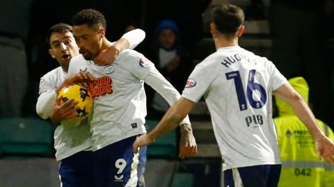 Preston North End striker Daniel Jebbison is congratulated by teammates after scoring against Coventry City