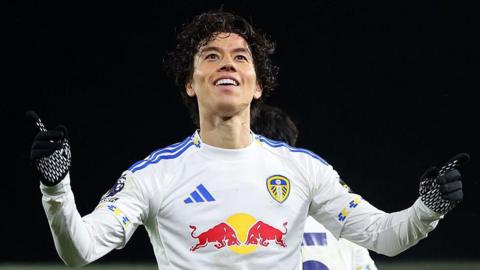 Ao Tanaka celebrates scoring against Liverpool