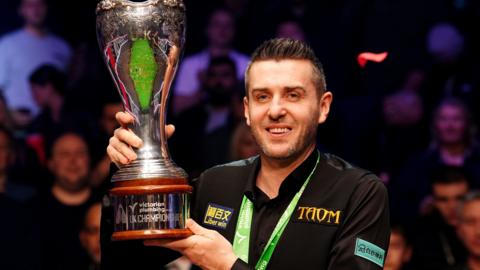 Mark Selby poses with the trophy