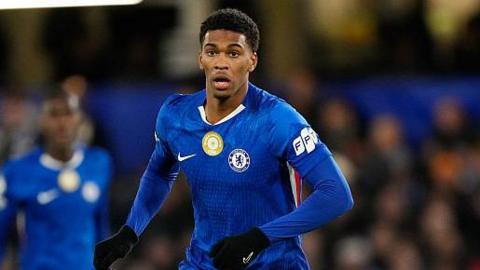 Josh Acheampong running in the match against Barcelona