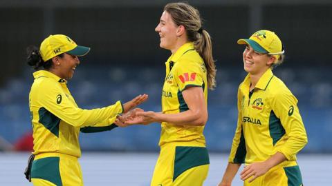 Australia players Alana King (left), Annabel Sutherland (middle) and Phoebe Litchfield celebrate a wicket v England