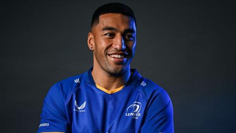 Rieko Ioane poses in a Leinster shirt