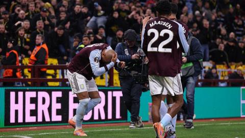 Donyell Malen of Aston Villa reacts after Young Boys fans threw items and drinks on the pitch