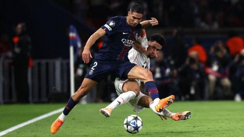 Bayern Munich forward Luis Diaz tackles Paris St-Germain full-back Achraf Hakimi