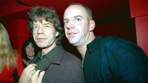 Norman Cook and Mick Jagger, pictured together at a David Bowie after-party in London, 1999