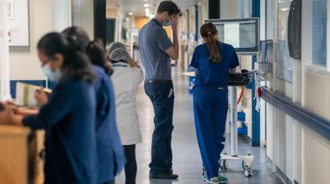 File photo dated 18/01/23 of a general view of staff on a NHS hospital ward.