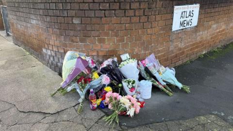 Several bunch of flowers lying on a road
