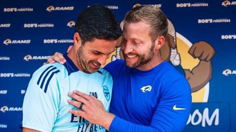 Arsenal manager Mikel Arteta chats with Los Angeles Rams head coach Sean McVay at a youth football clinic at the Rams' training camp in July 2024