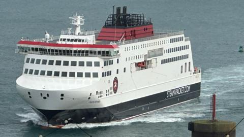 The Manxman ferry, which is white, red and black sailing in Douglas Bay.