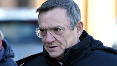 Derek Green is pictured outside a court. He has combed grey hair and wears a dark jacket and glasses