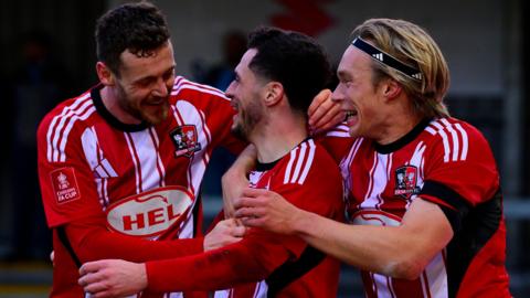 Exeter City celebrate scoring against Wycombe Wanderers in the FA Cup