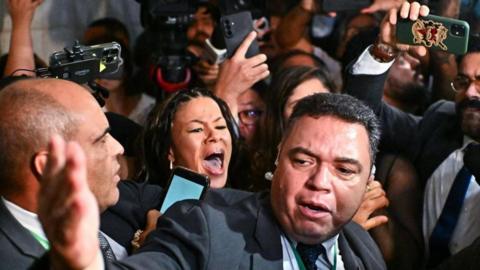 A crowd of people involved in a scuffle in Brazil's parliament