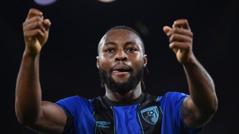 Footballer Semenyo celebrates a goal against Liverpool.