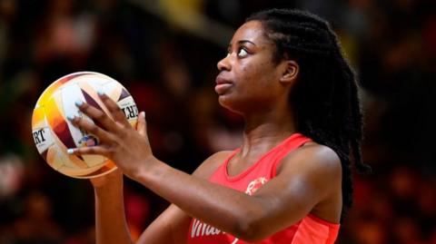 Liv Tchine lines up a shot while playing for England