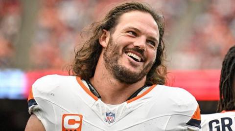 Alex Singleton of the Denver Broncos smiles before a game against the Houston Texans in November 2025