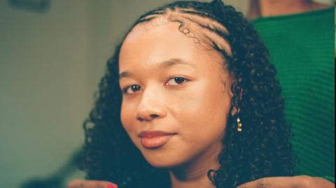Presenter Leona gets her hair braided